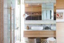 14 The bathrooms are as stylish as the rest of the house, featuring white marble walls and glass enclosures