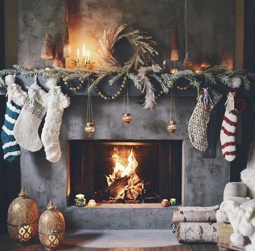 a fireplace with additional candles and lanterns around are enough to give your space cozy light