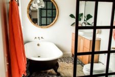 14 a mid-century modern meets contemporary bathroom done in black and white and accented with coral