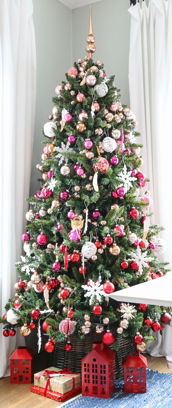 an ombre Christmas tree from silver and pink to hot pink and red is a bright idea, white snowflakes tie up all the parts