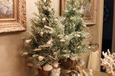 14 if you have a beachy bathroom, keep the holiday decor beachy, decorate your tree with shells