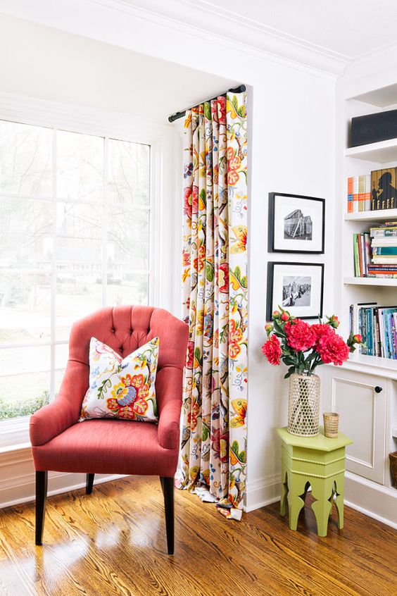 a coral upholstered chair is great addition to your reading nook, it's an easy way to cheer up your nook