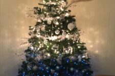 16 an ombre Christmas tree from white to silver nd bold blue, many lights and a shiny star on top will make an impression