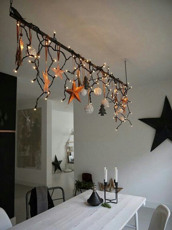 create an overhead decoration over the dining table and add lights to make your meals more festive