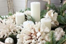 18 a gorgeous beach Christmas centerpiece with a dough bowl, corals, evergreens, candles and ornaments is easy to recreate