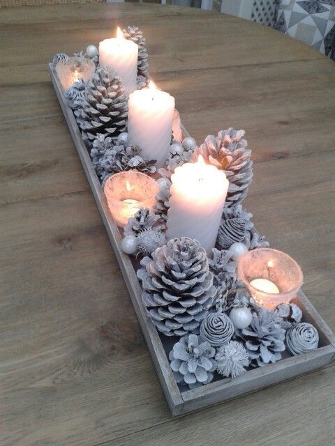a snowy Christmas centerpiece of whitewashed pinecones, beads, pearls and candles is a simple DIY idea