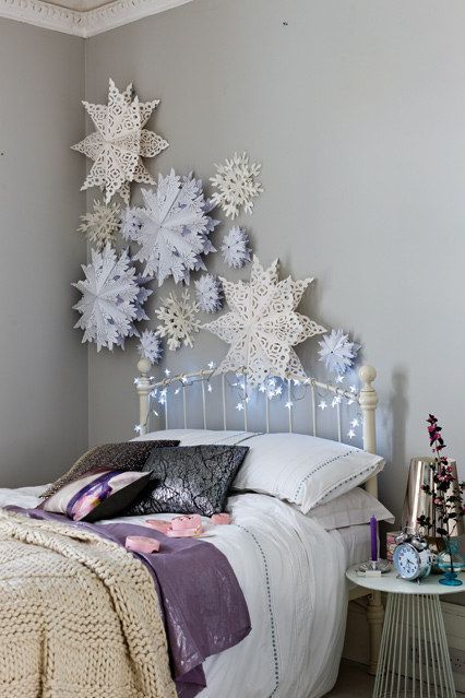 decorate the wall with paper snowflakes and lights to create a charming ambience while sleeping