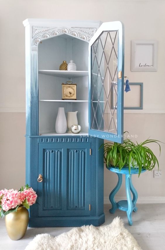 A vintage china cabinet is upgraded with a modern feel, with ombre from white to blue