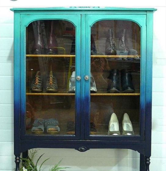 a vintage shoe cabinet with a gradient effect from turquoise to navy is a bold and beautiful option