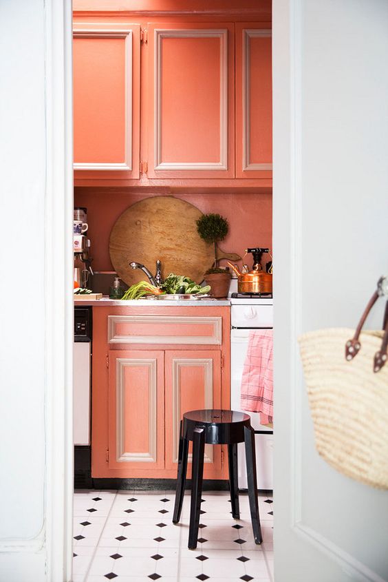 coral cabinets with white framing will make your kitchen bold and bright