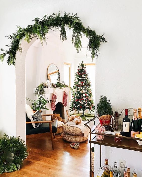 cover the archways with evergreens to make the space feel festive and not taking any floorspace