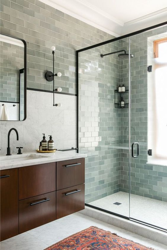 light green tiles in various shades make this bathroom very catchy, interesting and unusual