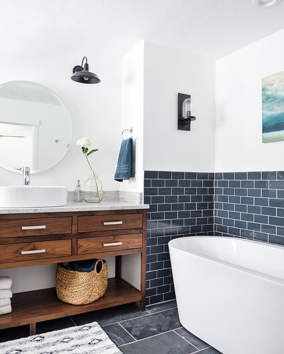 a backsplash of navy subway tiles with white grout is a refreshing and modern idea for a bathroom