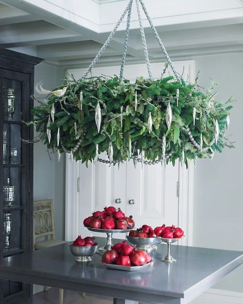 a lush hanging Christmas wreath chandelier with silver ornaments doesn't take much space