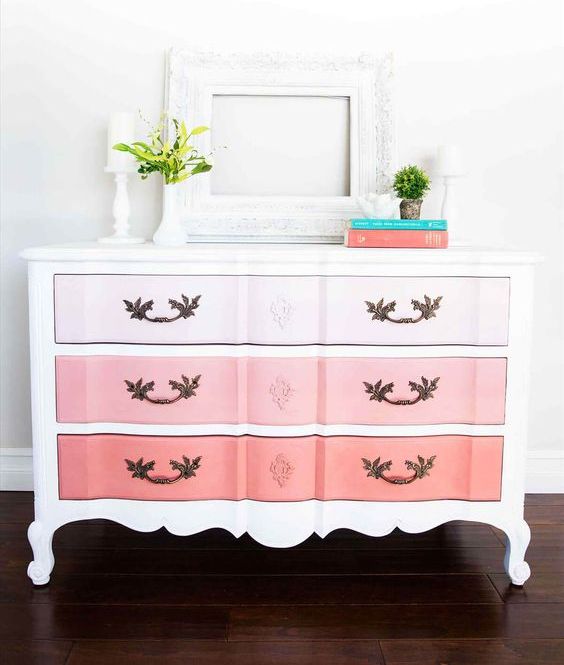 A vintage dresser with an ombre effect, from light pink to coral is a chic color statement
