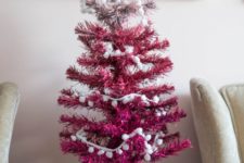 21 a little ombre blush to hot pink Christmas tree decorated wit pompoms and a glitter bow can be DIYed very fast and easily