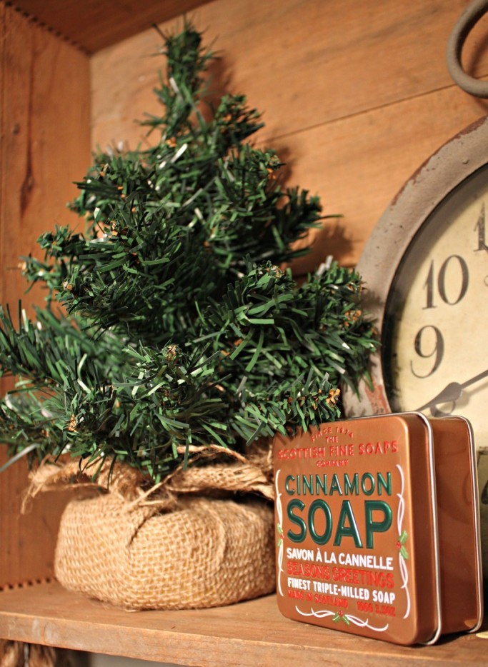 a fake Christmas tree will remind of the holidays and cinnamon soap will fill the space with a winter smell