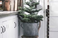 23 simple placing of a Christmas tree into a galvanized bucket is also ok, no decor is needed