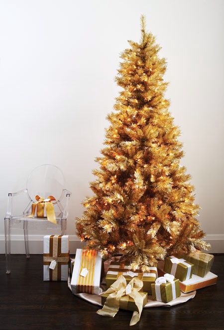 such a gold pre-lit Christmas tree doesn't require any special decor, it's beautiful and amazing itself