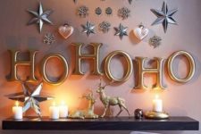 24 metallic letters and metallic hearts and stars attached right to the wall for holiday vibes