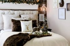 25 cabin Christmas bedroom with glam charm and faux fur, with silver trees and deer, with lots of pillows and a gallery wall