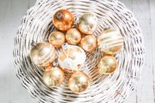 25 gold leaf Christmas ornaments can be displayed in baskets and bowls to make your decor special