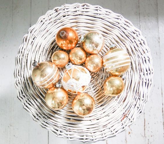 gold leaf Christmas ornaments can be displayed in baskets and bowls to make your decor special