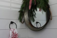 26 a mirror covered with evergreens, a red bow and add proper Christmas soap with winter smells