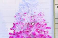 26 if you want to give your white Christmas tree a bold look, spray paint it pink with an ombre effect, it will look striking