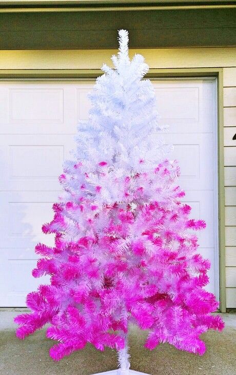 if you want to give your white Christmas tree a bold look, spray paint it pink with an ombre effect, it will look striking