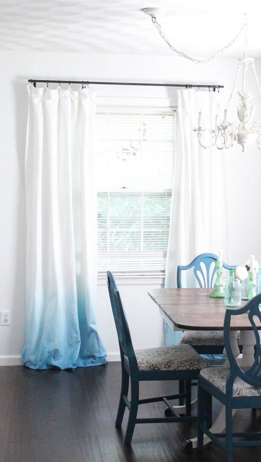Simple ombre curtains from white to light blue is a great idea for a beach or seaside interior and can be DIYed