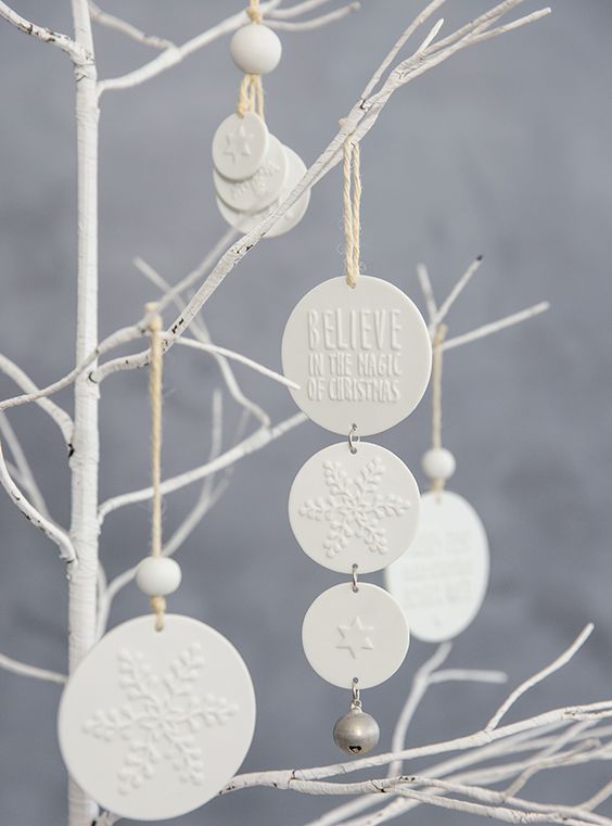 white clay Christmas ornaments with little jingle bells are a very cool decor and gift idea