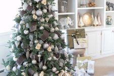 statement Christmas tree decor with silver grey ornaments, silver and chocolate brown ribbons plus snowflakes
