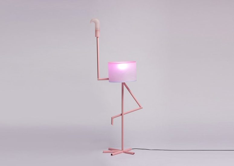 'I Am Cutie' is a fun and quirky lamp in pink and it features a flamingo standing on one leg