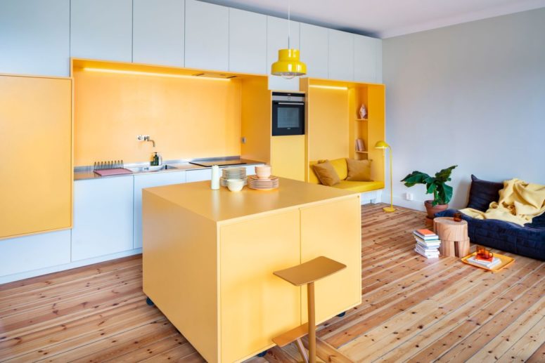 This contemporary apartment features sunny yellow as the main color as Sweden can't boast of much sunshine