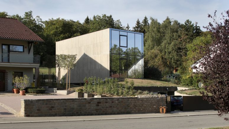 This unusual and monolith looking house features minimalist and even brutalist aesthetic