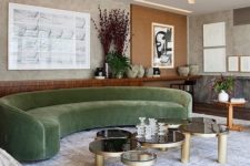 02 a fantastic green velvet curved sofa is a centerpiece featuring two trends at the same time – curves and velvet