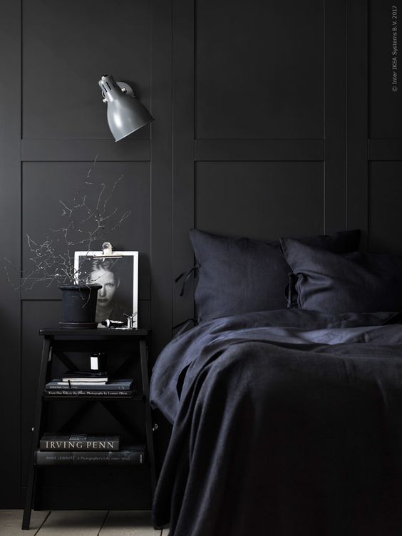 a moody bedroom with black bedding is a comfortable sleeping oasis for any winter