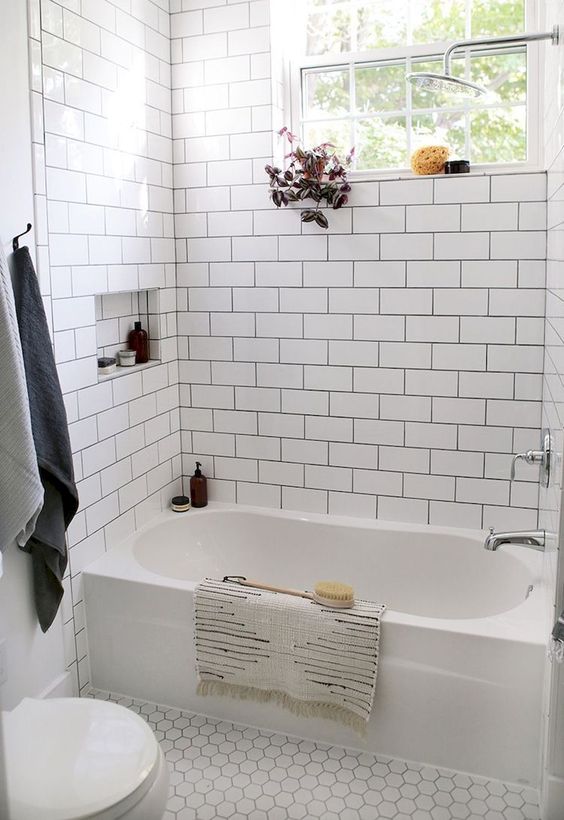 white tiles - subway ones on the walls and hex penny tiles on the floor for a soothing and calming look