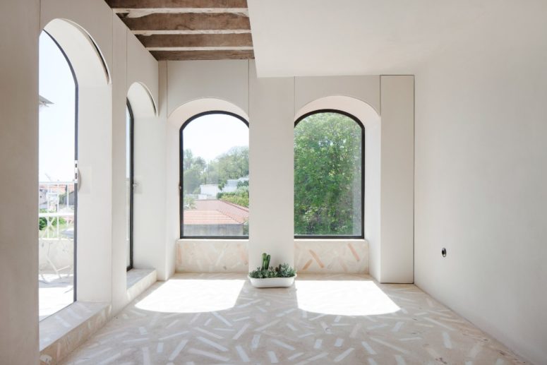 The adorable arched windows were highlighted with black frames and look at those mosaic floors - aren't they amazing