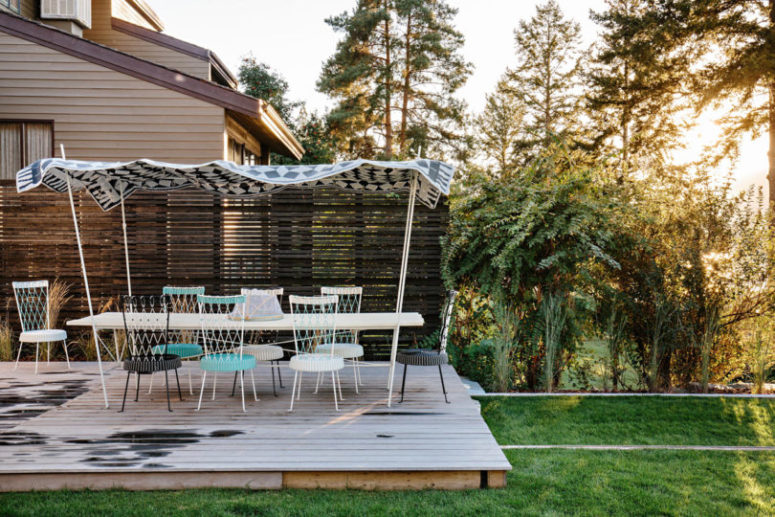 There's a comfy outdoor deck with a dining space to enjoy a fresh air and outdoor living
