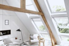 03 an off-white attic bedroom with stained wooden beams and all-neutral textiles and furniture