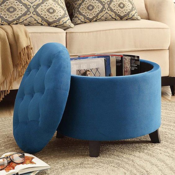an upholstered storage ottoman can double as a coffee table and is a smart option for a contemporary space