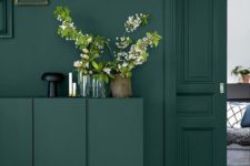 03 rock dark green on dark green and accent them with brass touches for a chic look
