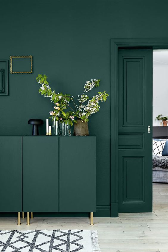 rock dark green on dark green and accent them with brass touches for a chic look