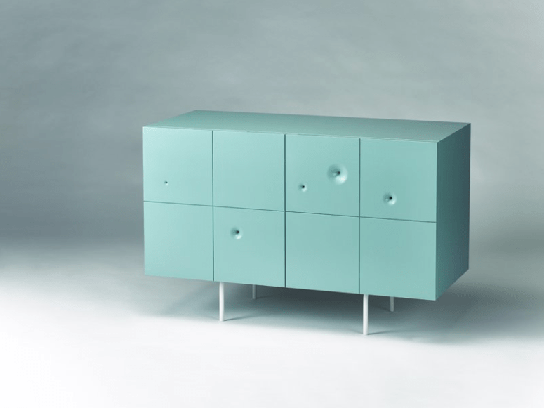 This is an aqua-colored cabinet of birch plywood, with severla wormholes