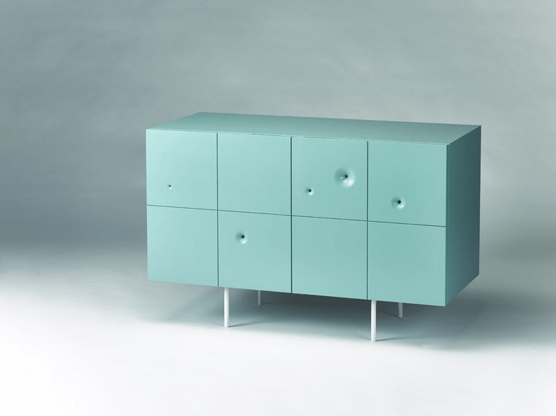This is an aqua colored cabinet of birch plywood, with severla wormholes
