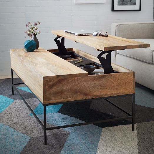 a minimalist coffee table that can be transformed into a desk or dining table easily and features storage