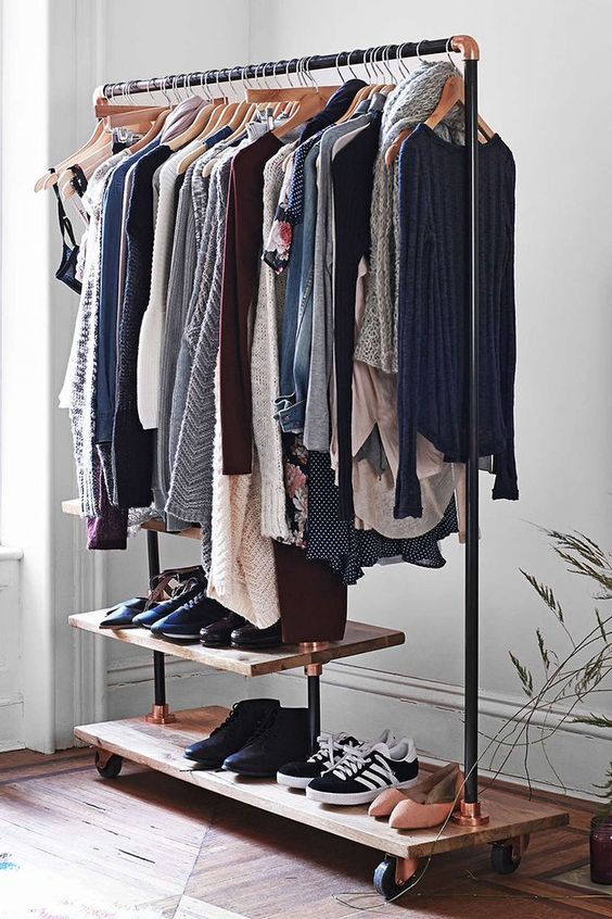 place an open storage rack for hanging clothes and placing shoes for your guests