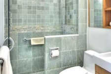 04 the same green color and different sizes of tiles with white grout for a relaxing and soothing little bathroom